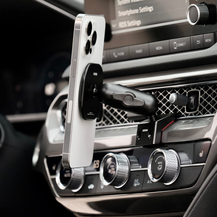 Image of Offroam MagSafe-compatible Phone Mount installed securely in Acura Integra 2023-2026. This premium phone mount installs easily without drilling or glue. High force magnets hold phone on any trail, road, or track. Perfect placement without blocking screens, driver view, or air flow. Fully adjustable positioning.