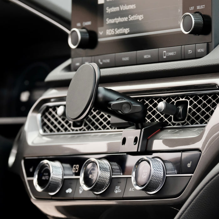 Image of Offroam MagSafe-compatible Phone Mount installed securely in Acura Integra 2023-2026. This premium phone mount installs easily without drilling or glue. High force magnets hold phone on any trail, road, or track. Perfect placement without blocking screens, driver view, or air flow. Fully adjustable positioning.