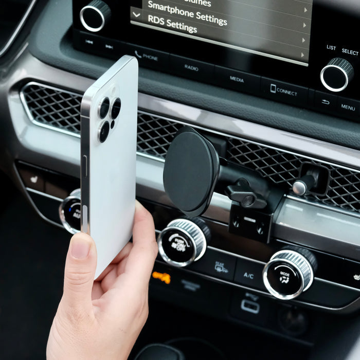 Image of Offroam MagSafe-compatible Phone Mount installed securely in Acura Integra 2023-2026. This premium phone mount installs easily without drilling or glue. High force magnets hold phone on any trail, road, or track. Perfect placement without blocking screens, driver view, or air flow. Fully adjustable positioning.