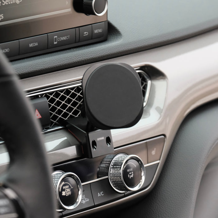 Image of Offroam MagSafe-compatible Phone Mount installed securely in Acura Integra 2023-2026. This premium phone mount installs easily without drilling or glue. High force magnets hold phone on any trail, road, or track. Perfect placement without blocking screens, driver view, or air flow. Fully adjustable positioning.