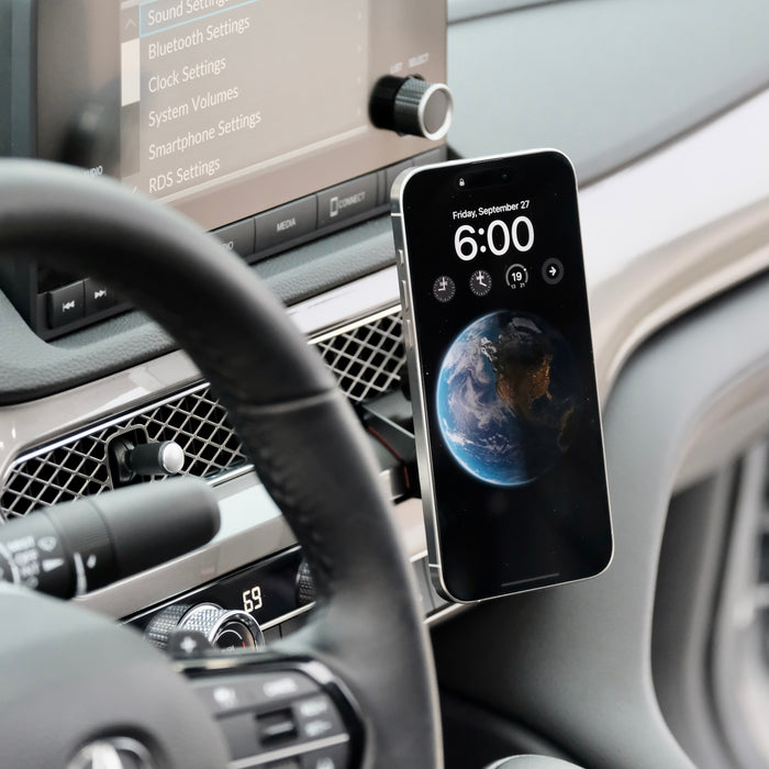 Image of Offroam MagSafe-compatible Phone Mount installed securely in Acura Integra 2023-2026. This premium phone mount installs easily without drilling or glue. High force magnets hold phone on any trail, road, or track. Perfect placement without blocking screens, driver view, or air flow. Fully adjustable positioning.