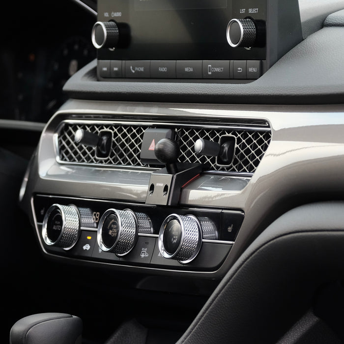 Image of Offroam Mounting Base installed securely in Acura Integra 2023-2026. This premium all metal phone mounting base installs easily without drilling or glue. Perfect placement without blocking screens, driver view, or air flow.