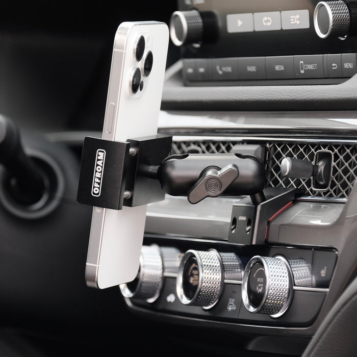 Image of Offroam Phone Mount installed securely in Acura Integra 2023-2026. This premium phone mount installs easily without drilling or glue. Spring loaded Universal holder for use with any phone. Perfect placement without blocking screens, driver view, or air flow. Fully adjustable positioning.