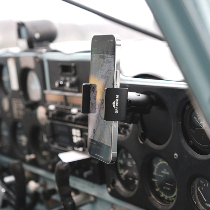 Image of Offroam Phone Mount for all General Aviation (GA) aircraft with inoperable instrument availability. This premium phone mount installs easily without drilling or glue. Spring loaded Universal holder for use with any phone. Perfect placement without blocking glass, analog gauges, or cockpit view. Fully adjustable positioning.