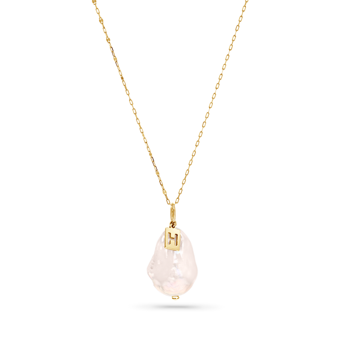 White baroque pearl with a 14k gold initial charm on a 14k solid gold chain.