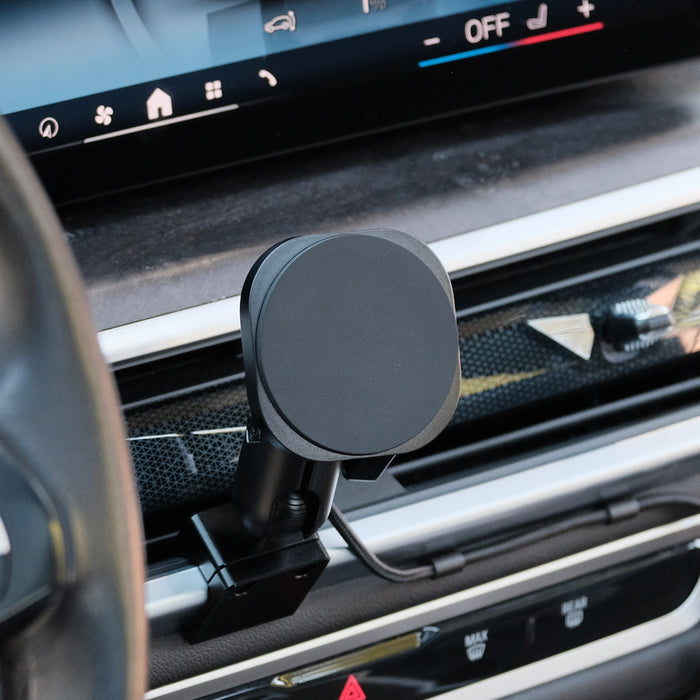 Image of Offroam MagSafe-compatible Phone Mount installed securely in BMW X5 2024-2026 | X6 2024-2027 | X7 2023-2027. This premium phone mount installs easily without drilling or glue. High force magnets hold phone on any trail, road, or track. Perfect placement without blocking screens, driver view, or air flow. Fully adjustable positioning.