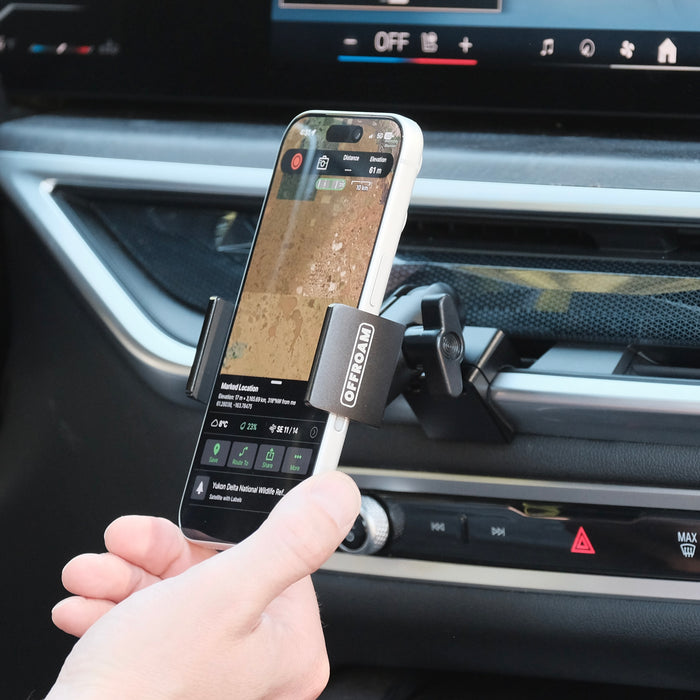 Image of Offroam Phone Mount installed securely in BMW X5 2024-2026 | X6 2024-2027 | X7 2023-2027. This premium phone mount installs easily without drilling or glue. Spring loaded Universal holder for use with any phone. Perfect placement without blocking screens, driver view, or air flow. Fully adjustable positioning.