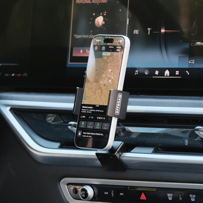 Image of Offroam Phone Mount installed securely in BMW X5 2024-2026 | X6 2024-2027 | X7 2023-2027. This premium phone mount installs easily without drilling or glue. Spring loaded Universal holder for use with any phone. Perfect placement without blocking screens, driver view, or air flow. Fully adjustable positioning.
