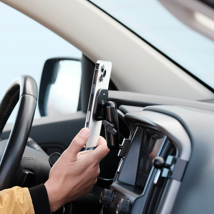 Image of Offroam MagSafe-compatible Phone Mount installed securely in Chevy Colorado | GMC Canyon 2015-2022. This premium phone mount installs easily without drilling or glue. High force magnets hold phone on any trail, road, or track. Perfect placement without blocking screens, driver view, or air flow. Fully adjustable positioning.