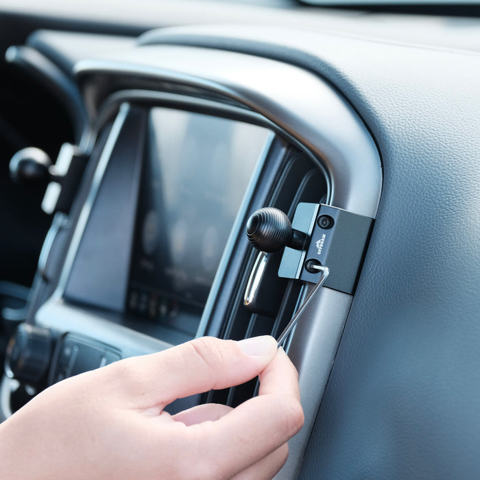 Image of Offroam Mounting Base installed securely in Chevy Colorado | GMC Canyon 2015-2022. This premium all metal phone mounting base installs easily without drilling or glue. Perfect placement without blocking screens, driver view, or air flow.