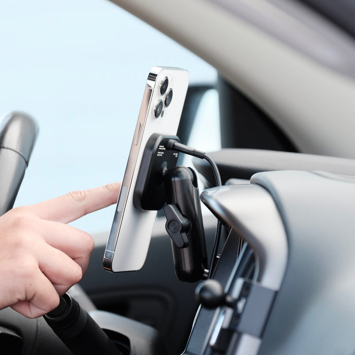 Image of Offroam MagSafe-compatible Phone Mount installed securely in Chevrolet Colorado | GMC Canyon 2015-2022. This premium phone mount installs easily without drilling or glue. High force magnets hold phone on any trail, road, or track. Perfect placement without blocking screens, driver view, or air flow. Fully adjustable positioning.