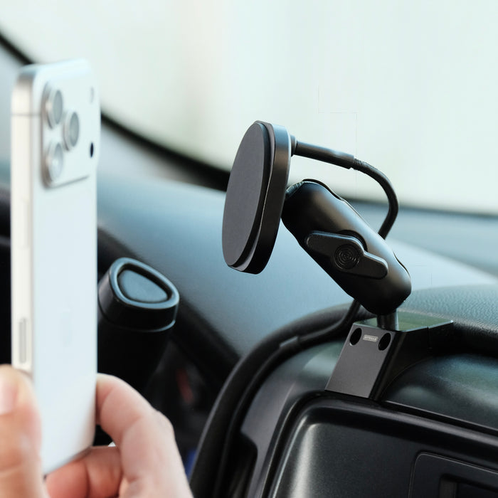 Image of Offroam MagSafe-compatible Phone Mount installed securely in Chevrolet Silverado 1500 2014-2018 | Silverado HD 2500/3500 2015-2019 | Silverado HD 4500/5500/6500 2019-2026 | GMC Sierra 1500 2014-2018 | Sierra HD 2500/3500 2015-2019. This premium phone mount installs easily without drilling or glue. High force magnets hold phone on any trail, road, or track. Perfect placement without blocking screens, driver view, or air flow. Fully adjustable positioning.