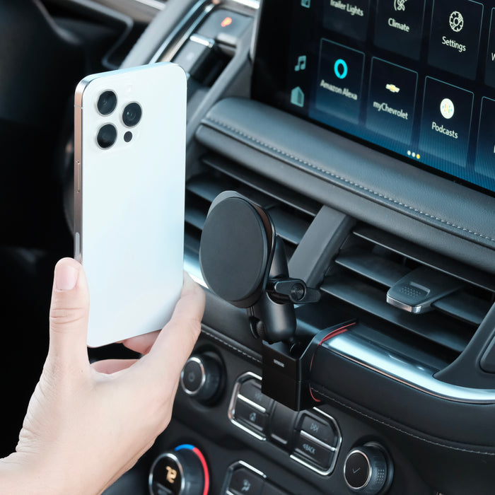 Image of Offroam MagSafe-compatible Phone Mount installed securely in Chevrolet Suburban | Tahoe & GMC Yukon | Yukon XL 2021-2024. This premium phone mount installs easily without drilling or glue. High force magnets hold phone on any trail, road, or track. Perfect placement without blocking screens, driver view, or air flow. Fully adjustable positioning.