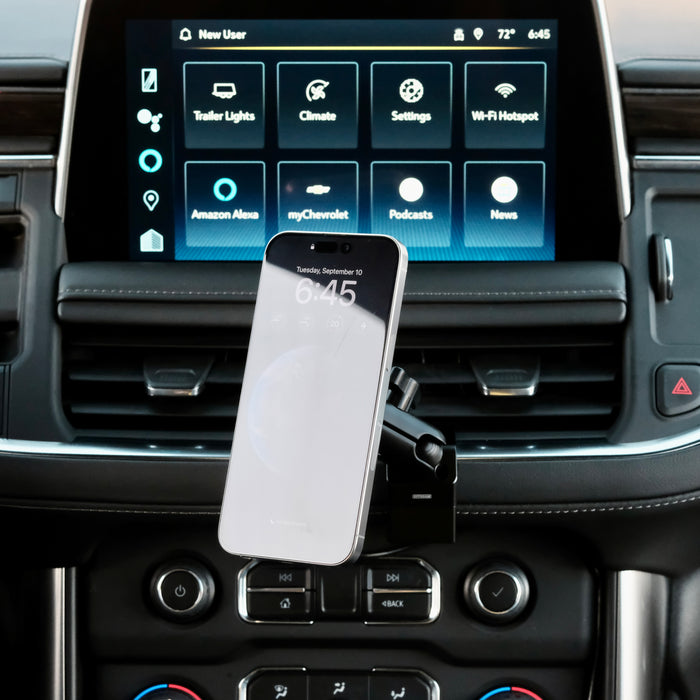Image of Offroam MagSafe-compatible Phone Mount installed securely in Chevrolet Suburban | Tahoe & GMC Yukon | Yukon XL 2021-2024. This premium phone mount installs easily without drilling or glue. High force magnets hold phone on any trail, road, or track. Perfect placement without blocking screens, driver view, or air flow. Fully adjustable positioning.