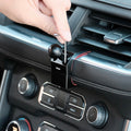 Image of Offroam Mounting Base installed securely in Chevrolet Suburban | Tahoe & GMC Yukon | Yukon XL 2021-2024. This premium all metal phone mounting base installs easily without drilling or glue. Perfect placement without blocking screens, driver view, or air flow.