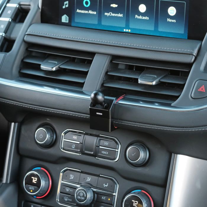 Image of Offroam Mounting Base installed securely in Chevrolet Suburban | Tahoe & GMC Yukon | Yukon XL 2021-2024. This premium all metal phone mounting base installs easily without drilling or glue. Perfect placement without blocking screens, driver view, or air flow.