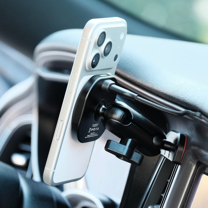 Image of Offroam MagSafe-compatible Phone Mount installed securely in Dodge Challenger 2015-2023. This premium phone mount installs easily without drilling or glue. High force magnets hold phone on any trail, road, or track. Perfect placement without blocking screens, driver view, or air flow. Fully adjustable positioning.