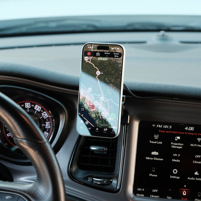 Image of Offroam MagSafe-compatible Phone Mount installed securely in Dodge Challenger 2015-2023. This premium phone mount installs easily without drilling or glue. High force magnets hold phone on any trail, road, or track. Perfect placement without blocking screens, driver view, or air flow. Fully adjustable positioning.