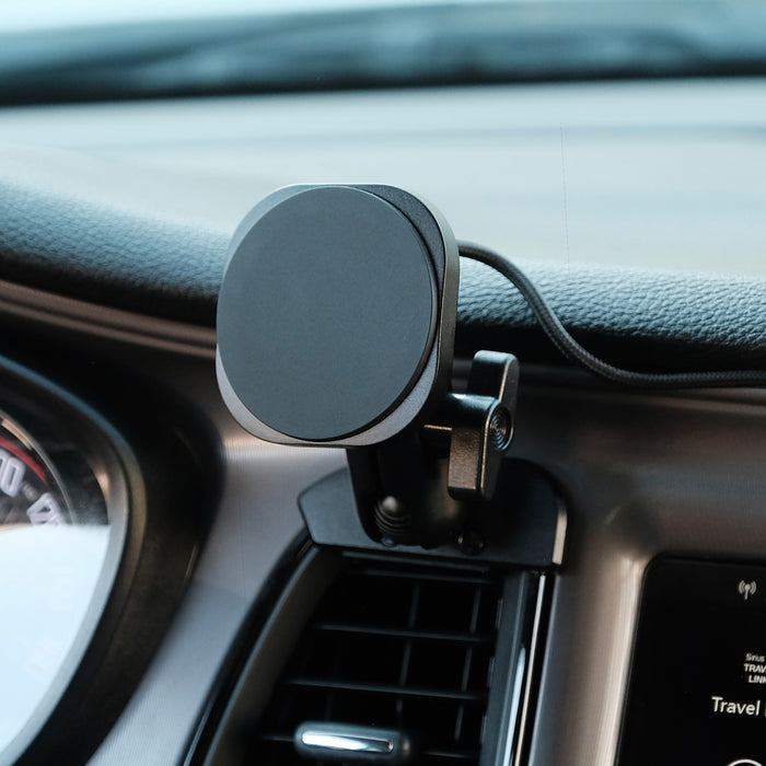 Image of Offroam MagSafe-compatible Phone Mount installed securely in Dodge Challenger 2015-2023. This premium phone mount installs easily without drilling or glue. High force magnets hold phone on any trail, road, or track. Perfect placement without blocking screens, driver view, or air flow. Fully adjustable positioning.