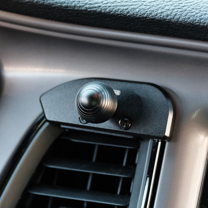 Image of Offroam Mounting Base installed securely in Dodge Challenger 2015-2023. This premium all metal phone mounting base installs easily without drilling or glue. Perfect placement without blocking screens, driver view, or air flow.
