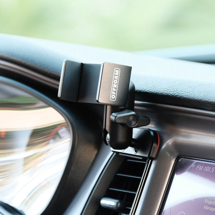Image of Offroam Phone Mount installed securely in Dodge Challenger 2015-2023. This premium phone mount installs easily without drilling or glue. Spring loaded Universal holder for use with any phone. Perfect placement without blocking screens, driver view, or air flow. Fully adjustable positioning.