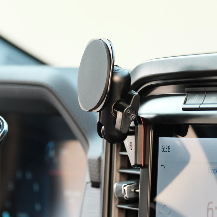 Image of Offroam MagSafe-compatible Phone Mount installed securely in Ford F-150 2021-2026 | F-250/F-350 2023-2026 | F-150 Lightning (XL & PRO) 2022-2026. This premium phone mount installs easily without drilling or glue. High force magnets hold phone on any trail, road, or track. Perfect placement without blocking screens, driver view, or air flow. Fully adjustable positioning.