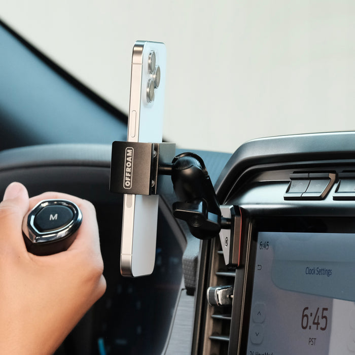 Image of Offroam Phone Mount installed securely in Ford F-150 2021-2026 | F-250/F-350 2023-2026 | F-150 Lightning (XL & PRO) 2022-2026. This premium phone mount installs easily without drilling or glue. Spring loaded Universal holder for use with any phone. Perfect placement without blocking screens, driver view, or air flow. Fully adjustable positioning.