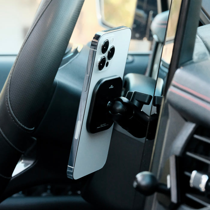 Image of Offroam MagSafe-compatible Phone Mount installed securely in Ford F-150 Lightning 2022-2025 (Lariat & Platinum) | Ford Expedition 2022-2024. This premium phone mount installs easily without drilling or glue. High force magnets hold phone on any trail, road, or track. Perfect placement without blocking screens, driver view, or air flow. Fully adjustable positioning.