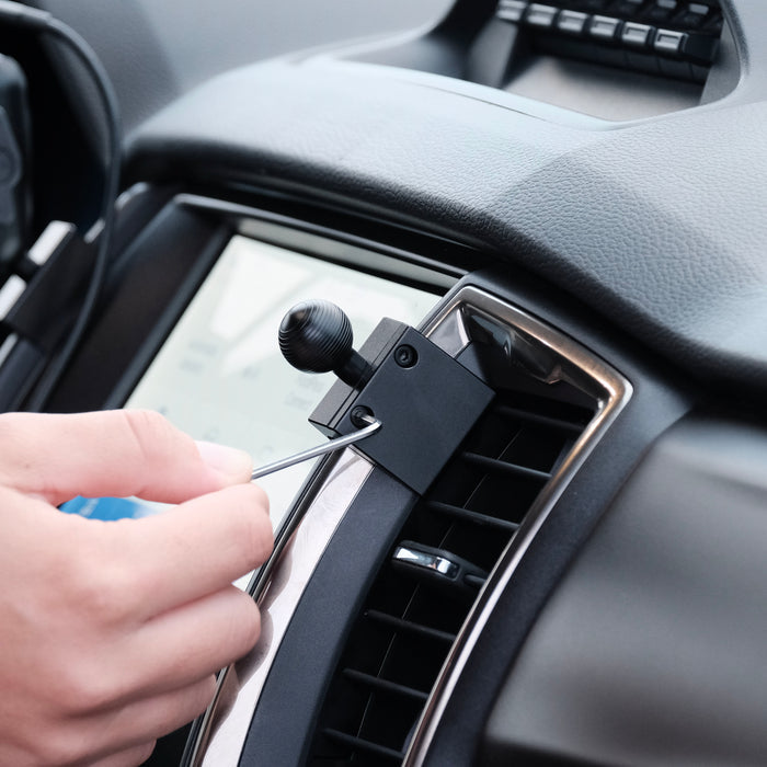 Image of Offroam Mounting Base installed securely in Ford Ranger 2019-2023. This premium all metal phone mounting base installs easily without drilling or glue. Perfect placement without blocking screens, driver view, or air flow.