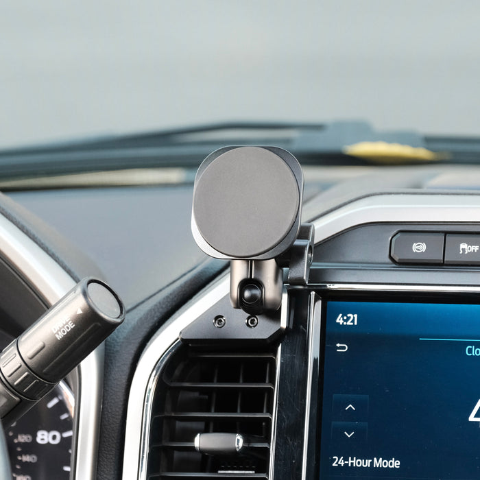 Image of Offroam MagSafe-compatible Phone Mount installed securely in Ford Super Duty 2022 (12in. SYNC4 Touchscreen). This premium phone mount installs easily without drilling or glue. High force magnets hold phone on any trail, road, or track. Perfect placement without blocking screens, driver view, or air flow. Fully adjustable positioning.