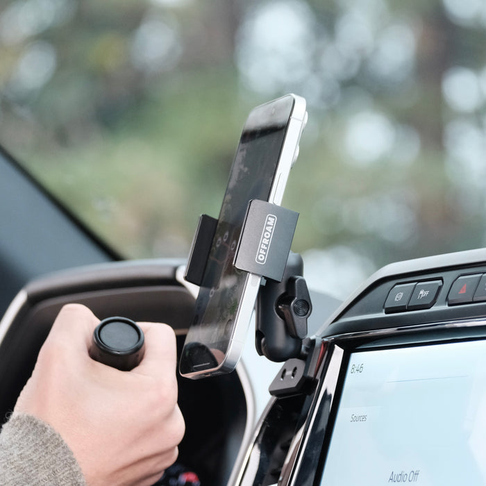 Image of Offroam Phone Mount installed securely in Ford Super Duty 2022 (12in. SYNC4 Touchscreen). This premium phone mount installs easily without drilling or glue. Spring loaded Universal holder for use with any phone. Perfect placement without blocking screens, driver view, or air flow. Fully adjustable positioning.