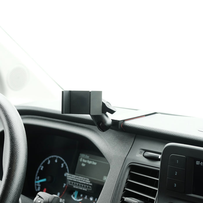 Image of Offroam Phone Mount installed securely in Ford Transit 2020-2026. This premium phone mount installs easily without drilling or glue. Spring loaded Universal holder for use with any phone. Perfect placement without blocking screens, driver view, or air flow. Fully adjustable positioning.
