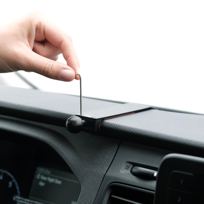 Image of Offroam Mounting Base installed securely in Ford Transit 2020-2026. This premium all metal phone mounting base installs easily without drilling or glue. Perfect placement without blocking screens, driver view, or air flow.