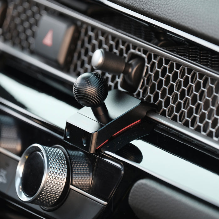 Image of Offroam Mounting Base installed securely in Honda Civic 2022-2026 | CR-V 2023-2026. This premium all metal phone mounting base installs easily without drilling or glue. Perfect placement without blocking screens, driver view, or air flow.