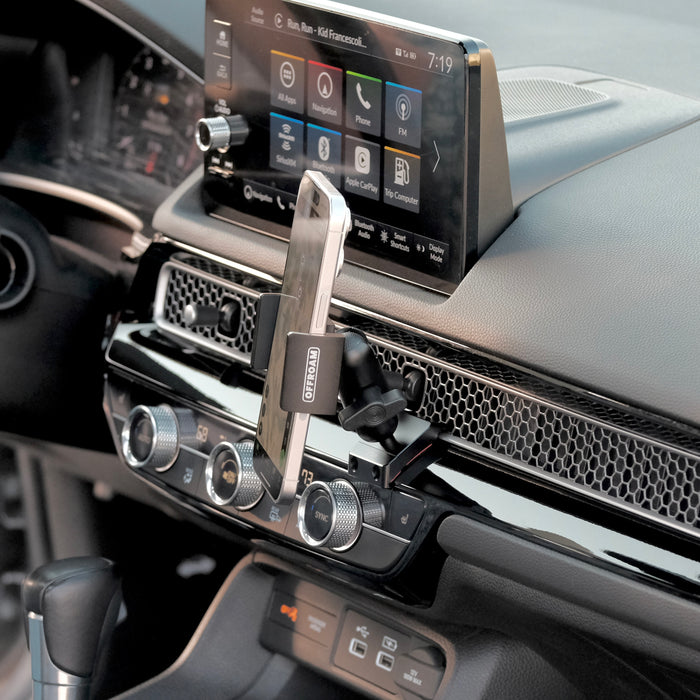 Image of Offroam Phone Mount installed securely in Honda Civic 2022-2026 | CR-V 2023-2026. This premium phone mount installs easily without drilling or glue. Spring loaded Universal holder for use with any phone. Perfect placement without blocking screens, driver view, or air flow. Fully adjustable positioning.