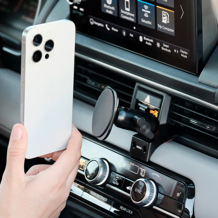 Image of Offroam MagSafe-compatible Phone Mount installed securely in Honda Pilot 2023-2026 | Passport 2026. This premium phone mount installs easily without drilling or glue. High force magnets hold phone on any trail, road, or track. Perfect placement without blocking screens, driver view, or air flow. Fully adjustable positioning.