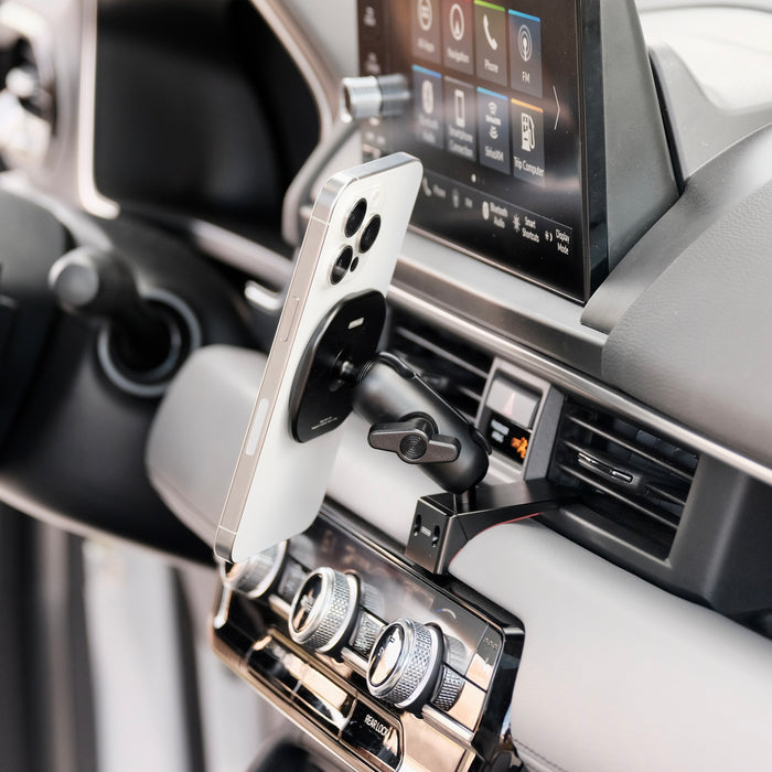 Image of Offroam MagSafe-compatible Phone Mount installed securely in Honda Pilot 2023-2026 | Passport 2026. This premium phone mount installs easily without drilling or glue. High force magnets hold phone on any trail, road, or track. Perfect placement without blocking screens, driver view, or air flow. Fully adjustable positioning.