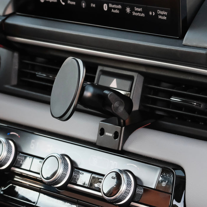 Image of Offroam MagSafe-compatible Phone Mount installed securely in Honda Pilot 2023-2026 | Passport 2026. This premium phone mount installs easily without drilling or glue. High force magnets hold phone on any trail, road, or track. Perfect placement without blocking screens, driver view, or air flow. Fully adjustable positioning.