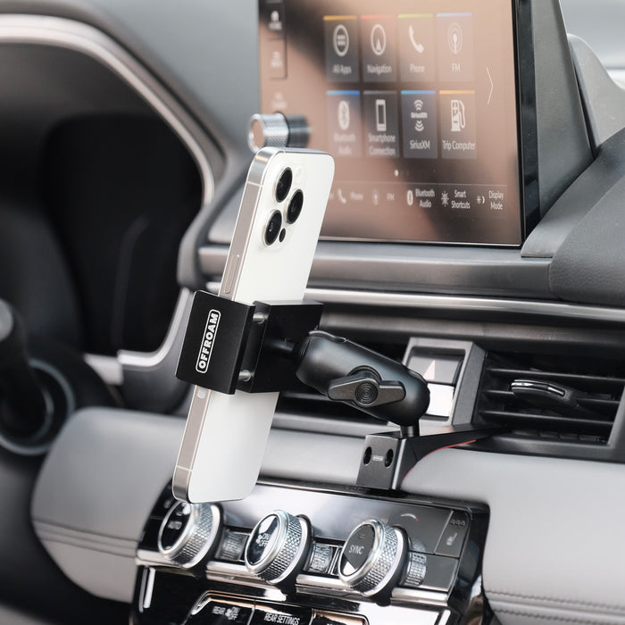 Image of Offroam Phone Mount installed securely in Honda Pilot 2023-2026 | Passport 2026. This premium phone mount installs easily without drilling or glue. Spring loaded Universal holder for use with any phone. Perfect placement without blocking screens, driver view, or air flow. Fully adjustable positioning.
