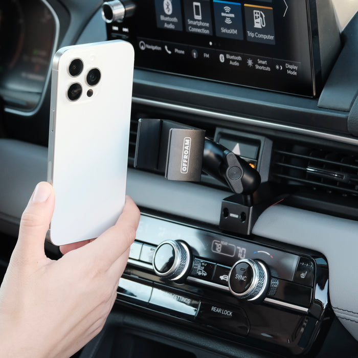 Image of Offroam Phone Mount installed securely in Honda Pilot 2023-2026 | Passport 2026. This premium phone mount installs easily without drilling or glue. Spring loaded Universal holder for use with any phone. Perfect placement without blocking screens, driver view, or air flow. Fully adjustable positioning.