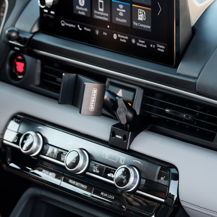 Image of Offroam Phone Mount installed securely in Honda Pilot 2023-2026 | Passport 2026. This premium phone mount installs easily without drilling or glue. Spring loaded Universal holder for use with any phone. Perfect placement without blocking screens, driver view, or air flow. Fully adjustable positioning.
