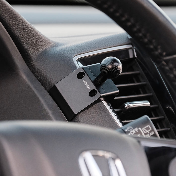 Image of Offroam Mounting Base installed securely in Honda Ridgeline 2016-2026 | Passport 2019-2025 | Pilot 2016-2022. This premium all metal phone mounting base installs easily without drilling or glue. Perfect placement without blocking screens, driver view, or air flow.