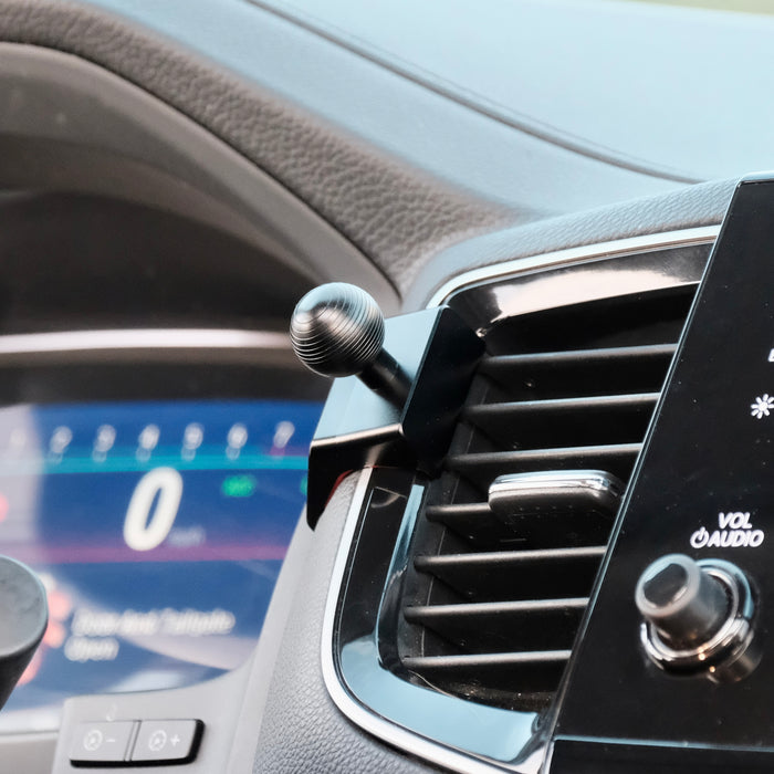 Image of Offroam Mounting Base installed securely in Honda Ridgeline 2016-2026 | Passport 2019-2025 | Pilot 2016-2022. This premium all metal phone mounting base installs easily without drilling or glue. Perfect placement without blocking screens, driver view, or air flow.