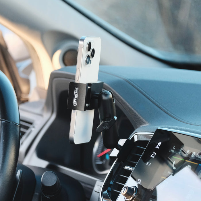 Image of Offroam Phone Mount installed securely in Honda Ridgeline 2016-2026 | Passport 2019-2025 | Pilot 2016-2022. This premium phone mount installs easily without drilling or glue. Spring loaded Universal holder for use with any phone. Perfect placement without blocking screens, driver view, or air flow. Fully adjustable positioning.