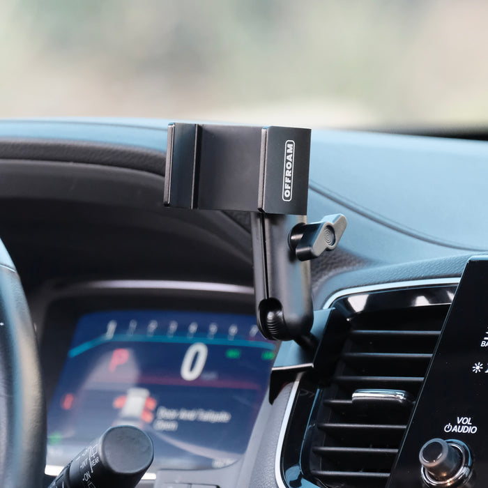Image of Offroam Phone Mount installed securely in Honda Ridgeline 2016-2026 | Passport 2019-2025 | Pilot 2016-2022. This premium phone mount installs easily without drilling or glue. Spring loaded Universal holder for use with any phone. Perfect placement without blocking screens, driver view, or air flow. Fully adjustable positioning.