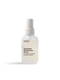 Auf weißem Hintergrund ruht eine mattierte Tropfflasche mit der Aufschrift Hydrating Microbiome Drops von nkm Naturkosmetik München GmbH, ideal für feuchtigkeitsspendendes Liquid und sichtbar hydratisierte Haut.