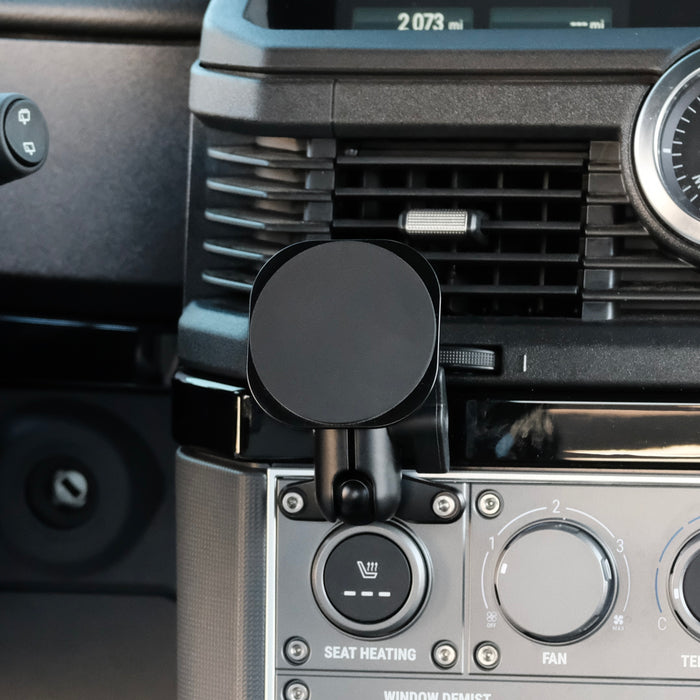Image of Offroam MagSafe-compatible Phone Mount installed securely in INEOS Grenadier 2022-2026. This premium phone mount installs easily without drilling or glue. High force magnets hold phone on any trail, road, or track. Perfect placement without blocking screens, driver view, or air flow. Fully adjustable positioning.