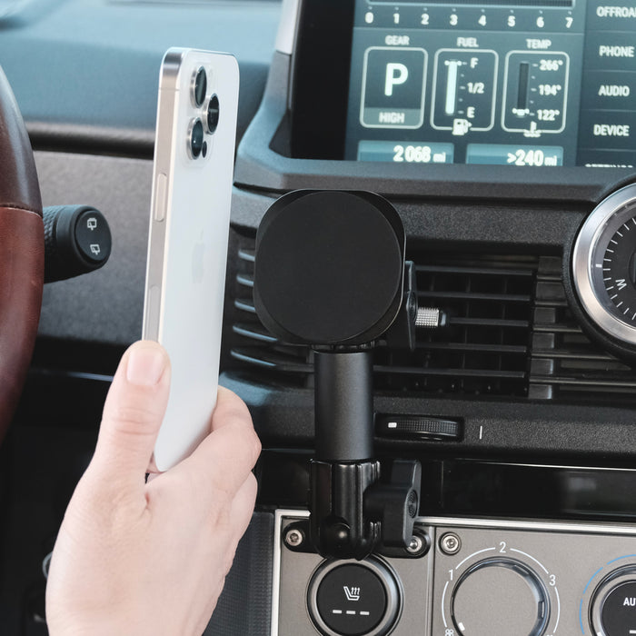 Image of Offroam MagSafe-compatible Phone Mount installed securely in INEOS Grenadier 2022-2026. This premium phone mount installs easily without drilling or glue. High force magnets hold phone on any trail, road, or track. Perfect placement without blocking screens, driver view, or air flow. Fully adjustable positioning.