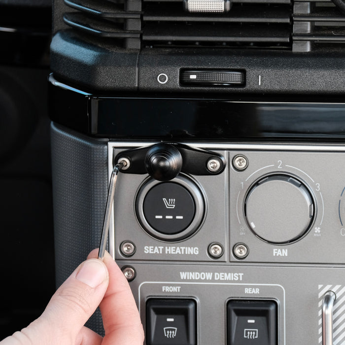 Image of Offroam Mounting Base installed securely in INEOS Grenadier 2022-2026. This premium all metal phone mounting base installs easily without drilling or glue. Perfect placement without blocking screens, driver view, or air flow.