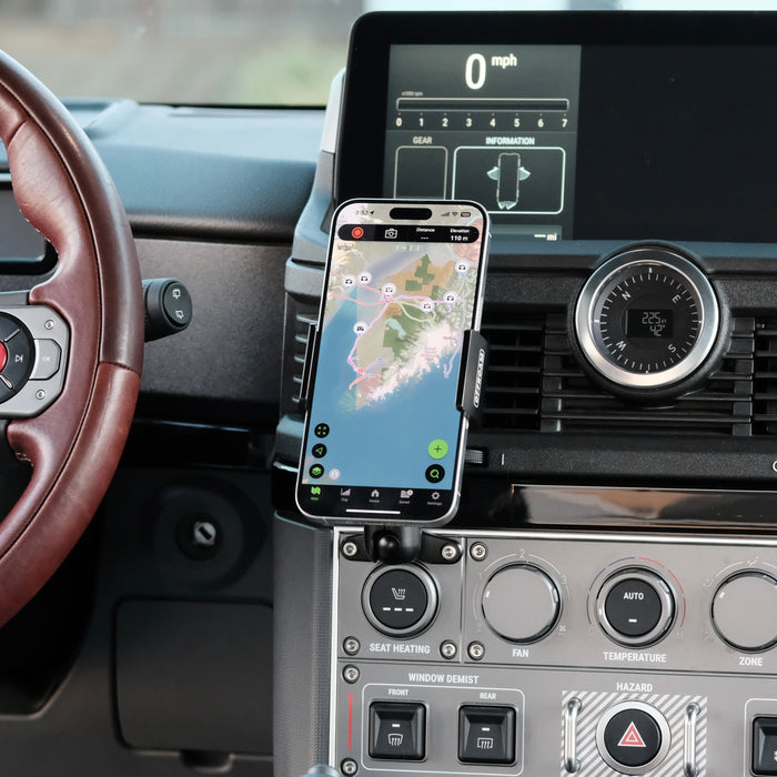 Image of Offroam Phone Mount installed securely in INEOS Grenadier 2022-2026. This premium phone mount installs easily without drilling or glue. Spring loaded Universal holder for use with any phone. Perfect placement without blocking screens, driver view, or air flow. Fully adjustable positioning.